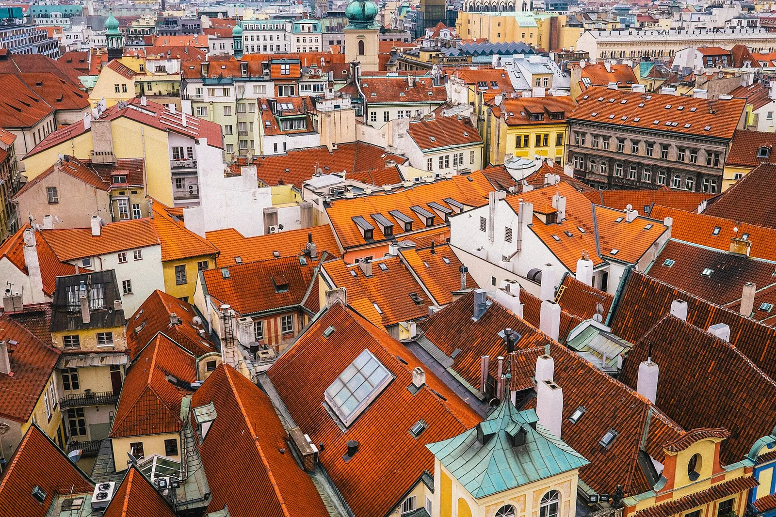 View from the Old Town Hall Tower over the red roofs of Prague’s Old Town